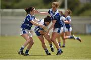 22 July 2017; Martha Kirwan of Laois in action against Aisling Doonan, left, and Claragh O'Reilly, right, of Cavan during the TG4 Senior All Ireland Championship Preliminary match between Cavan and Laois in Ashbourne, Co. Meath.  Photo by Barry Cregg/Sportsfile