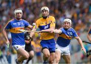 22 July 2017; Conor McGrath of Clare in action against Seán O'Brien of Tipperary and Seamus Kennedy, left, during the GAA Hurling All-Ireland Senior Championship Quarter-Final match between Clare and Tipperary at Páirc Uí Chaoimh in Cork. Photo by Ray McManus/Sportsfile