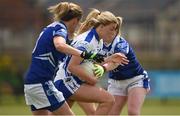 22 July 2017; Ciara Burke of Laois in action against Ailish Cornyn, left, and Laura Fitzpatrick, right, of Cavan of Laois during the TG4 Senior All Ireland Championship Preliminary match between Cavan and Laois in Ashbourne, Co. Meath.  Photo by Barry Cregg/Sportsfile