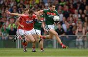 22 July 2017; Tom Parsons of Mayo in action against Tomás Clancy of Cork during the GAA Football All-Ireland Senior Championship Round 4A match between Cork and Mayo at Gaelic Grounds in Co. Limerick. Photo by Piaras Ó Mídheach/Sportsfile