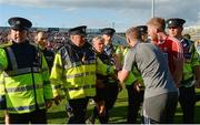 22 July 2017; Cork selector Billy Sheehan has words with referee Ciarán Branagan after the game as he is assisted from the field by members of An Garda Síochána after the GAA Football All-Ireland Senior Championship Round 4A match between Cork and Mayo at Gaelic Grounds in Co. Limerick. Photo by Piaras Ó Mídheach/Sportsfile