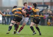 24 March 2012; Killian Lett, Clontarf, in action against Shane O'Neill, left, and Ray Moloney, Young Munster. Ulster Bank League Division 1A, Young Munster v Clontarf, Tom Clifford Park, Limerick. Picture credit: Diarmuid Greene / SPORTSFILE