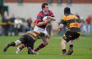 24 March 2012; Killian Lett, Clontarf, in action against Neville Melbourne, left, and Alan Cotter, Young Munster. Ulster Bank League Division 1A, Young Munster v Clontarf, Tom Clifford Park, Limerick. Picture credit: Diarmuid Greene / SPORTSFILE