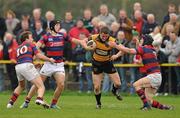 24 March 2012; Aaron Carroll, Young Munster, in action against Evan Ryan, left, Noel Reid, centre, and Barry O'Mahony, Clontarf. Ulster Bank League Division 1A, Young Munster v Clontarf, Tom Clifford Park, Limerick. Picture credit: Diarmuid Greene / SPORTSFILE