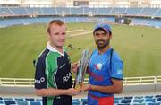 24 March 2012; Ireland captain William Porterfield, left, and Afghanistan captain Nawroz Mangal with the tournament trophy before the match. ICC World Twenty20 Qualifier Final, Afghanistan v Ireland, Dubai International Cricket Stadium, Dubai, United Arab Emirates. Picture credit: Ian Jacobs / SPORTSFILE
