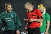 24 March 2012; Limerick selector Ciaran Carey, left, in conversation with referee Cathal McAllister as he looks at his watch after the game. Allianz Hurling League, Division 1B, Round 4, Limerick v Offaly, Gaelic Grounds, Limerick. Picture credit: Diarmuid Greene / SPORTSFILE