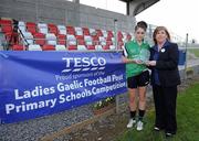 24 March 2012; Jacinta Nurney, from Tesco Kinnegad, presents Colaiste Ide agus Iosef team captain Laura Sheeran with her player of the match trophy. Tesco All-Ireland Post Primary Schools Senior A Final, Loreto, Omagh v Colaiste Ide agus Iosef, Limerick, Kinnegad, Co. Westmeath. Picture credit: Matt Browne / SPORTSFILE