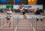 25 March 2012; Claire Murphy, St. L. O'Toole, Co. Carlow, on her way to winning the U-19 Girl's 60m Hurdles ahead of Emily Geoghegan, Donore Harriers, Dublin, during the Woodie’s DIY AAI Juvenile Indoor Championships of Ireland. Nenagh Indoor Arena, Nenagh, Co. Tipperary. Picture credit: Barry Cregg / SPORTSFILE