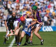 23 July 2017; Tadhg de Búrca of Waterford is tackled by Podge Doran, left, and Simon Donohoe of Wexford during the GAA Hurling All-Ireland Senior Championship Quarter-Final match between Wexford and Waterford at Páirc Uí Chaoimh in Cork. Photo by Ray McManus/Sportsfile