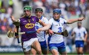 23 July 2017; Aidan Nolan of Wexford in action against Jamie Barron, 8, and Kevin Moran of Waterford during the GAA Hurling All-Ireland Senior Championship Quarter-Final match between Wexford and Waterford at Páirc Uí Chaoimh in Cork. Photo by Ray McManus/Sportsfile