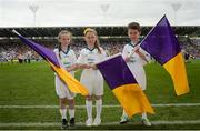 23 July 2017; Bord Gáis Energy flagbearers, from left, Lauren Bennett, age 9, Vivian Moran, age 8, and Luke Leahy, age 11, ahead of the GAA Hurling All-Ireland Senior Championship Quarter-Final match between Wexford and Waterford at Páirc Uí Chaoimh in Cork. Photo by Cody Glenn/Sportsfile