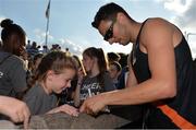 23 July 2017; Brian Gregan of Clonliffe Harriers AC, Co. Dublin, signs an autograph for Rachel Hanrahan,10, of Brother Pearse AC, Co. Dublin, who was a member of the Irish Life Health Cheer Squad, during the Irish Life Health National Senior Track & Field Championships – Day 2 at Morton Stadium in Santry, Co. Dublin. Photo by Sam Barnes/Sportsfile