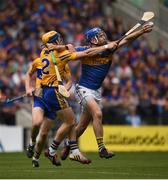 22 July 2017; John McGrath of Tipperary in action against Seadna Morey of Clare during the GAA Hurling All-Ireland Senior Championship Quarter-Final match between Clare and Tipperary at Páirc Uí Chaoimh in Co. Cork. Photo by Cody Glenn/Sportsfile