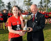25 March 2012; Rosin O'Sullivan, University College Cork, is presented with the O'Connor Cup by Pat Quill, President of the Ladies Gaelic Football Association. O'Connor Cup final, University of Ulster Jordanstown v University College Cork, Queen's University Belfast, University Road, Belfast. Picture credit: Oliver McVeigh / SPORTSFILE