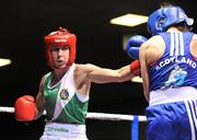 23 March 2012; Dervla Duffy, Ireland, left, exchanges punches with Kristen Frazser, Holland, during their 57kg bout. Women's Boxing International, Ireland v Holland, National Stadium, Dublin. Picture credit: Barry Cregg / SPORTSFILE