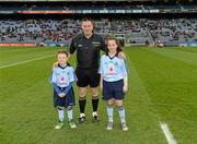 24 March 2012; Mascots Jason Hyland, Edenmore, and Aoife Traynor, Griffith Avenue, with referee Brian Gavin before the Allianz Hurling League Game, Croke Park, Dublin. Picture credit: Ray McManus / SPORTSFILE