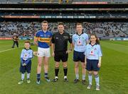24 March 2012; The Tipperary captain, Padraic Maher, and the Dublin captain, John McCaffrey, with mascots Jason Hyland, Edenmore, and Aoife Traynor, Griffith Avenue, and referee Brian Gavin before the Allianz Hurling League Game, Croke Park, Dublin. Picture credit: Ray McManus / SPORTSFILE