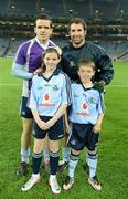 24 March 2012; Mascots Lauren Plummer, 11 years, from Donaghmede, and Luke Ennis, 10, from Coolock, Dublin captain Bryan Cullen and Ger Brennan before the Allianz Football League Game, Croke Park, Dublin. Picture credit: Ray McManus / SPORTSFILE