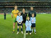 24 March 2012; Mascots Lauren Plummer, 11 years, from Donaghmede, Ciara Brogan, 4, Navan Road, and Luke Ennis, 10, from Coolock, with Dublin captain, Bryan Cullen, match referee Eddie Kinsella, and the Donegal captain, Michael Murphy, before the Allianz Football League Game, Croke Park, Dublin. Picture credit: Ray McManus / SPORTSFILE