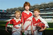 27 March 2012; In attendance at the national launch of the 2012 Kellogg’s GAA Cúl Camps are Jack Sullivan, left, age 9, from Howth, Co. Dublin, Daniel Ryan, age 10, from Templeogue, Co. Dublin, and Matthew Ryan, right, age 9, from Templeogue, Co. Dublin. Croke Park, Dublin Photo by Sportsfile