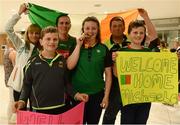 24 July 2017; Michaela Walsh, who won bronze in the Hammer, pictured with her cousins Mikey Gallagher, right, age 13, and Dylan Gallagher, age 10, and other family members at the homecoming of the Irish Team from the European Athletics Under-20 Championships in Italy at Dublin Airport. Photo by Sam Barnes/Sportsfile