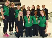 24 July 2017; Pictured are Michaela Walsh, second, from left, who won bronze in the Hammer, and Gina Akpe-Moses, second from right, who won gold in the 100m's, with their team-mates at the homecoming of the Irish Team from the European Athletics Under-20 Championships in Italy at Dublin Airport. Photo by Sam Barnes/Sportsfile