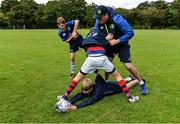 26 July 2017; Leinster Coach, Stephen Maher, in action with Ben Crowe and Charlie Coughlan at the Bank of Ireland Leinster Rugby School of Excellence at The King's Hospital in Dublin. Photo by Sam Barnes/Sportsfile