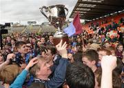 19 March 2012; St. Michael’s manager Dominic Corrigan lifts the cup alongside players and supporters. MacRory Cup Final, St. Patrick’s, Maghera v St. Michael’s, Enniskillen, Bessbrook, Morgan Athletic Grounds, Armagh. Picture credit: Oliver McVeigh / SPORTSFILE