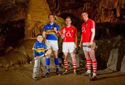 28 March 2012; Tipperary's John O'Brien along with 6-year-old Patrick Bailey, from Burncourt, Co. Tipperary and Cork’s Paudie O'Sullivan and Cathal Naughton, right, were on the Tipperary and Cork border today, at Mitchelstown Cave, as part of the GAA’s promotion of the Allianz Leagues. This Sunday, April 1st, Tipperary will host Cork in Semple Stadium in the final round of the Allianz Hurling League, Division 1A. Mitchelstown Caves, Cahir, Co. Tipperary. Picture credit: Diarmuid Greene  / SPORTSFILE