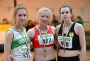 31 March 2012; Winner of the Girls Under 18 Long Jump Sarah McCarthy, Fingallians Athletic Club, Swords, Co. Dublin, with second place Marie Healon, Emerald Athletic Club, Co. Limerick, left, and third place Eileen Woods, Naas Athletic Club, Co. Kildare. Woodie’s DIY AAI Juvenile Indoor Championships of Ireland, Nenagh Indoor Arena, Nenagh, Co. Tipperary. Picture credit: Matt Browne / SPORTSFILE
