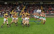 31 March 2012; The Crossmaglen Rangers and Garrycastle teams argue over who has their team photograph taken first as both teams arrive at the bench at the same time before the game. Crossmaglen Rangers ended up having &quot;possession&quot; of the bench first. AIB GAA Football All-Ireland Senior Club Championship Final, Replay, Crossmaglen Rangers v Garrycastle, Kingspan Breffni Park, Cavan. Picture credit: Brendan Moran / SPORTSFILE