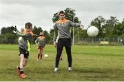 27 July 2017; Mayo's Lee Keegan watches Oran Butler in action during Lee Keegan's Kellogg’s GAA Cul Camps Surprise Visit at Leitrim Town Centre in Leitrim. Photo by Matt Browne/Sportsfile