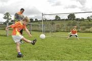 27 July 2017; Adam Malone takes a penalty watches by Lee during the Lee Keegan's Kellogg’s GAA Cul Camps Surprise Visit at Leitrim Town Centre in Leitrim. Photo by Matt Browne/Sportsfile