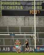 31 March 2012; Dessie Dolan, Garrycastle, stands alongside his Crossmaglen marker James Morgan and goalkeeper Paul Hearty as the scoreboard shows his side down by 10 points with 4 munites 23 seconds left in the first half. AIB GAA Football All-Ireland Senior Club Championship Final, Replay, Crossmaglen Rangers v Garrycastle, Kingspan Breffni Park, Cavan. Picture credit: Brendan Moran / SPORTSFILE