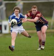 31 March 2012; Roisin Howard, Colaiste Dun Iascaigh, is tackled by Niamh O'Neill, Loreto Convent. Tesco All-Ireland Post Primary Schools Junior A Final, Colaiste Dun Iascaigh, Cahir, Co. Tipperary v Loreto Convent, Omagh, Co. Tyrone, Moate GAA Club, Hogan Park, Moate, Co. Westmeath. Picture credit: Ray McManus / SPORTSFILE