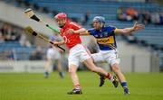 1 April 2012; Lorcan McLoughlin, Cork, in action against James Woodlock, Tipperary. Allianz Hurling League Division 1A, Round 5, Tipperary v Cork, Semple Stadium, Thurles, Co. Tipperary. Picture credit: Brendan Moran / SPORTSFILE