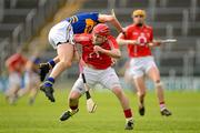 1 April 2012; Paul Curran, Tipperary, is tackled by Paudie O'Sullivan, Cork. Allianz Hurling League Division 1A, Round 5, Tipperary v Cork, Semple Stadium, Thurles, Co. Tipperary. Picture credit: Brendan Moran / SPORTSFILE