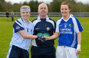 1 April 2012; The Dublin captain, Gemma Fay, and the Laois captain, Tracey Lawlor, shake hands across referee Michael Henry before the 'toss'. Bord Gais Energy Ladies National Football League Division 1, Round 7, Dublin v Laois, Naomh Mearnog, Portmarnock, Dublin. Picture credit: Ray McManus / SPORTSFILE