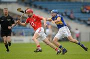 1 April 2012; Lorcan McLoughlin, Cork, in action against James Woodlock, Tipperary. Allianz Hurling League Division 1A, Round 5, Tipperary v Cork, Semple Stadium, Thurles, Co. Tipperary. Picture credit: Brendan Moran / SPORTSFILE
