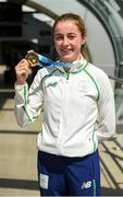 30 July 2017; Team Ireland arrive at Dublin Airport with 6 medals following competition at the 2017 European Youth Olympic Festival, EYOF, in Gyor, Hungary. The multi-sport event saw 40 Irish athletes, aged 14-16, compete against the best youth athletes in Europe. The six sports represented by Ireland were Athletics, Cycling, Swimming, Judo, Tennis and Gymnastics. Pictured is Team Ireland's Sarah Healy, from Monkstown, Co. Dublin, with her gold medal after finishing first in the women's 1500m, at Dublin Airport, Dublin. Photo by Seb Daly/Sportsfile