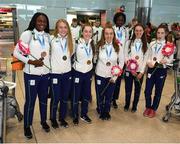30 July 2017; Team Ireland arrive at Dublin Airport with 6 medals following competition at the 2017 European Youth Olympic Festival, EYOF, in Gyor, Hungary. The multi-sport event saw 40 Irish athletes, aged 14-16, compete against the best youth athletes in Europe. The six sports represented by Ireland were Athletics, Cycling, Swimming, Judo, Tennis and Gymnastics. Pictured is Team Ireland's medal winners, from left, Patience Jumbo Gula, from Dundalk, Co. Louth, Lara Gillespie, from Enniskerry, Co. Wicklow, Sarah Healy, from Monkstown, Co. Dublin, Jade Williams, from Baillieborough, Co. Cavan, Rhasidat Adeleke, from Tallaght, Dublin, Miriam Daly, from Carrick-on-Suir, Co. Tipperary, and Niamh Foley, from Newcastle, Co. Limerick, with their medals, at Dublin Airport, Dublin. Photo by Seb Daly/Sportsfile