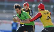4 April 2012; Munster's Conor Murray is tackled by Luke O'Dea, left, and Duncan Williams during squad training ahead of their Heineken Cup Quarter-Final game against Ulster on Sunday. Munster Rugby Squad Training, Thomond Park, Limerick. Picture credit: Diarmuid Greene / SPORTSFILE
