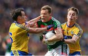 30 July 2017; Donal Vaughan of Mayo is tackled by Niall Kilroy, left, and Niall McInerney of Roscommon during the GAA Football All-Ireland Senior Championship Quarter-Final match between Mayo and Roscommon at Croke Park in Dublin. Photo by Ramsey Cardy/Sportsfile