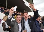 31 July 2017; Cousins Conor O'Grady, left, and Fergal Flannery, from Galway City, celebrate a winner after backing Dinky Inty, with Gary Halpin up, to win the Claytonhotelgalway.ie Handicap during the Galway Races Summer Festival 2017 at Ballybrit, in Galway. Photo by Cody Glenn/Sportsfile
