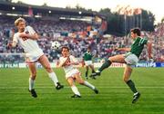 15 June 1988; Kevin Sheedy of Republic of Ireland in action against Oleksiy Mykhailychenko, left, and Igor Belanov of USSR during the UEFA European Football Championship Finals Group B match between Republic of Ireland and USSR at the Niedersachen Stadium in Hanover, Germany. Photo by Ray McManus/Sportsfile