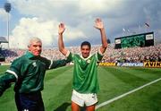 12 June 1988; Chris Hughton of Republic of Ireland and physio Mick Byrne celebrate after the UEFA European Football Championship Finals Group B match between England and Republic of Ireland at Neckarstadion in Stuttgart, Germany. Photo by Ray McManus/Sportsfile