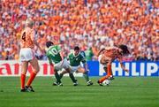 18 June 1988; Ruud Gullit of Netherlands in action against Chris Hughton and Frank Stapleton, left, of Republic of Ireland during the UEFA European Football Championship Finals Group B match between Republic of Ireland and Netherlands at Parkstadion in Gelsenkirchen, Germany. Photo by Ray McManus/Sportsfile