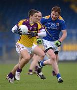 8 April 2012; Ciaran Lyng, Wexford, in action against John O'Shea, Longford. Allianz Football League Division 3, Round 7, Longford v Wexford, Glennon Brothers Pearse Park, Co. Longford. Picture credit: Ray McManus / SPORTSFILE