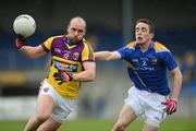 8 April 2012; James Holmes, Wexford, in action against Colm P. Smyth, Longford. Allianz Football League Division 3, Round 7, Longford v Wexford, Glennon Brothers Pearse Park, Co. Longford. Picture credit: Ray McManus / SPORTSFILE