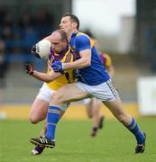 8 April 2012; James Holmes, Wexford, in action against Barry Gilleran, Longford. Allianz Football League Division 3, Round 7, Longford v Wexford, Glennon Brothers Pearse Park, Co. Longford. Picture credit: Ray McManus / SPORTSFILE